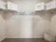 Organized walk-in closet with wire shelving and ample storage space, ready for customization at 2710 Golden Trout Ln, Edgewater, FL 32141