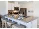Modern kitchen features stainless appliances, granite countertops, and white cabinetry at 2712 Golden Trout Ln, Edgewater, FL 32141