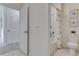Bathroom with shower-tub combo and toilet with modern decor, neutral colors, and tile flooring at 279 Wisteria Ct, Deltona, FL 32738