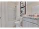 Bathroom featuring a shower and tub combination, a white toilet, and a vanity sink at 279 Wisteria Ct, Deltona, FL 32738