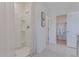 Bright bathroom with shower, tile flooring, and walk-in closet, providing a clean and functional space at 279 Wisteria Ct, Deltona, FL 32738