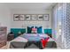 A shark-themed bedroom features playful decor, a comfortable bed, and stylish shark-themed curtains at 279 Wisteria Ct, Deltona, FL 32738