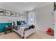 Bright bedroom featuring decorative shark themed decor, a window, and neutral walls at 279 Wisteria Ct, Deltona, FL 32738