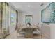 Elegant dining room with stylish table setting, large window, and contemporary decor at 279 Wisteria Ct, Deltona, FL 32738
