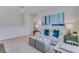 Comfortable living room with a sofa, teal accents, natural light, and neutral tones at 279 Wisteria Ct, Deltona, FL 32738
