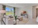 Cozy living room with a large window, comfortable seating, and modern entertainment center at 279 Wisteria Ct, Deltona, FL 32738