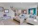 Bright open-concept living room with a staircase, stylish decor, and lots of natural light at 279 Wisteria Ct, Deltona, FL 32738