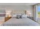 Main bedroom featuring a luxurious bed, side tables, and serene decor at 279 Wisteria Ct, Deltona, FL 32738
