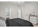 Bedroom featuring a white dresser, neutral carpet, and an open bathroom entrance at 2810 San Jacinto Cir # 2810, Sanford, FL 32771
