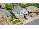 View of this spacious townhome featuring a two-car garage, balcony, manicured landscaping and concrete driveway at 2810 San Jacinto Cir # 2810, Sanford, FL 32771