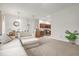 Spacious living room with carpet flooring, light walls, and seamless flow into the kitchen area at 2810 San Jacinto Cir # 2810, Sanford, FL 32771