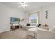 Bright living room with carpet flooring, ceiling fan, lots of natural light, and neutral furnishings at 2810 San Jacinto Cir # 2810, Sanford, FL 32771