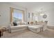 Open-concept living room with a large window, neutral furniture, and a view into the dining area at 2810 San Jacinto Cir # 2810, Sanford, FL 32771
