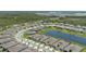 Expansive aerial view of a neighborhood featuring mature trees, ponds, and manicured lawns at 2960 Cherry Blossom Loop, St Cloud, FL 34771
