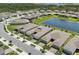 Beautiful aerial view of neighborhood with pond and well-manicured lawns at 2960 Cherry Blossom Loop, St Cloud, FL 34771