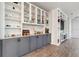 Custom bar area with display shelves, wine storage, and ample counter space for entertaining guests at 2960 Cherry Blossom Loop, St Cloud, FL 34771