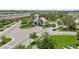 A view of the community entrance with a guard house and lush landscaping at 2960 Cherry Blossom Loop, St Cloud, FL 34771