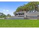 The Del Webb Sunbridge community entrance features a stone sign, waterfall feature, and lush landscaping at 2960 Cherry Blossom Loop, St Cloud, FL 34771