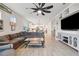 Well-lit living room showcasing the open layout with the kitchen and dining area in the background at 2960 Cherry Blossom Loop, St Cloud, FL 34771