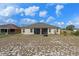 Backyard featuring a screened in patio, and expansive yard at 322 Huron Dr, Kissimmee, FL 34759