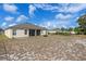 Backyard featuring an expansive yard and a screened-in patio at 322 Huron Dr, Kissimmee, FL 34759