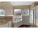 Bathroom featuring a bathtub, separate shower, and a vanity at 322 Huron Dr, Kissimmee, FL 34759