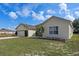 A charming, single-story home with a well-manicured lawn and attached two-car garage at 322 Huron Dr, Kissimmee, FL 34759
