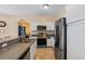 Modern kitchen features stainless appliances, stylish cabinets and breakfast bar area for seating at 322 Huron Dr, Kissimmee, FL 34759