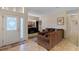 A spacious living room boasts a modern TV and comfortable seating with tile floors at 322 Huron Dr, Kissimmee, FL 34759