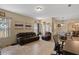 Inviting living area with tiled floors, casual seating, and an adjacent dining area at 322 Huron Dr, Kissimmee, FL 34759