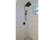 Bathroom showing stand up shower featuring updated shower head, modern fixtures, and new tile at 326 Hobart Ave, Daytona Beach, FL 32114