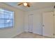 Bedroom features a closet, window, ceiling fan, and neutral walls creating a relaxing atmosphere at 326 Hobart Ave, Daytona Beach, FL 32114