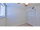 Bright bedroom featuring a ceiling fan, closet, and window with neutral walls and tile flooring at 326 Hobart Ave, Daytona Beach, FL 32114