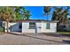 Cozy single-story home featuring a brick driveway and mature landscaping at 326 Hobart Ave, Daytona Beach, FL 32114
