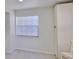 Bright kitchen with white cabinets, stainless appliances, and natural light from the window at 326 Hobart Ave, Daytona Beach, FL 32114