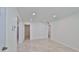 Spacious living room boasts recessed lighting and neutral tile flooring, providing a bright and modern living space at 326 Hobart Ave, Daytona Beach, FL 32114