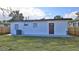 Rear exterior featuring a well-maintained yard, offering a charming view and outdoor space at 326 Hobart Ave, Daytona Beach, FL 32114