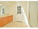 Bright bathroom featuring a walk-in shower, lots of counter space, and tile flooring at 345 Feather Pl, Longwood, FL 32779