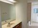 Bathroom with neutral colors, a large mirror, and a shower/tub combo at 345 Feather Pl, Longwood, FL 32779