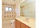 Cozy bathroom featuring a tile tub and single sink vanity at 345 Feather Pl, Longwood, FL 32779