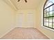 Bright bedroom with large window, carpeted floors, and closet space at 345 Feather Pl, Longwood, FL 32779