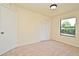 Cozy carpeted bedroom with closet, light and window at 345 Feather Pl, Longwood, FL 32779