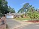 Charming single-Gathering home with brick accents, mature trees, and well-maintained landscaping at 345 Feather Pl, Longwood, FL 32779