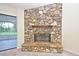 Stone fireplace with wooden mantle at 345 Feather Pl, Longwood, FL 32779