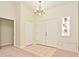 Foyer featuring tile and carpet flooring and a decorative window at 345 Feather Pl, Longwood, FL 32779
