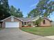Charming single-story brick home with manicured lawn and two-car garage at 345 Feather Pl, Longwood, FL 32779