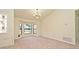 Large, sunlit living area with chandelier lighting and views of the front yard at 345 Feather Pl, Longwood, FL 32779