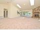 Spacious living room with fireplace, skylights, and sliding glass doors at 345 Feather Pl, Longwood, FL 32779