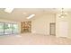 Spacious living room with stone fireplace, skylight, and access to the patio at 345 Feather Pl, Longwood, FL 32779
