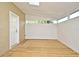 Covered patio with wood floor, white wood walls, and natural light at 345 Feather Pl, Longwood, FL 32779